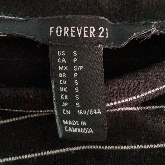 A black full sleeved shirt with white stripes. - Picture 2 of 2